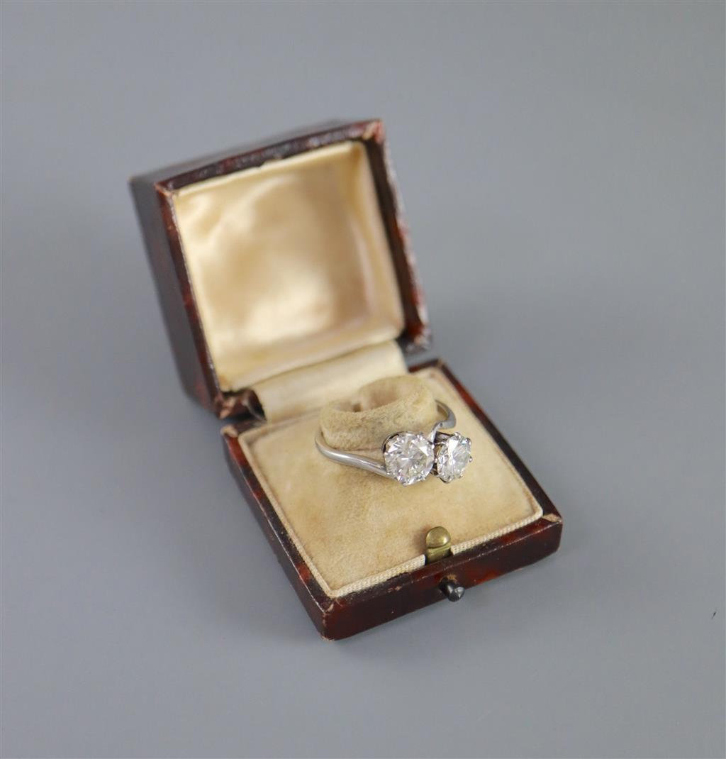 A platinum? and two stone diamond crossover ring,